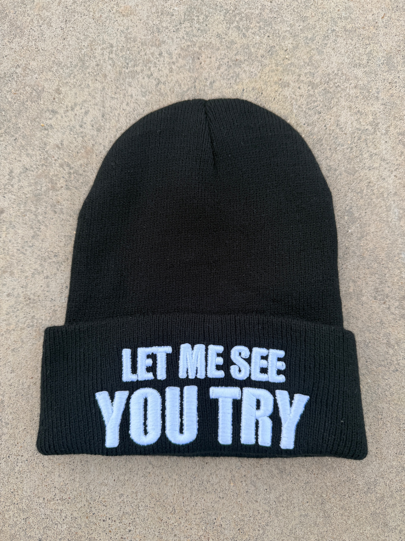 Origin beanie — front view of the embroidered cuff