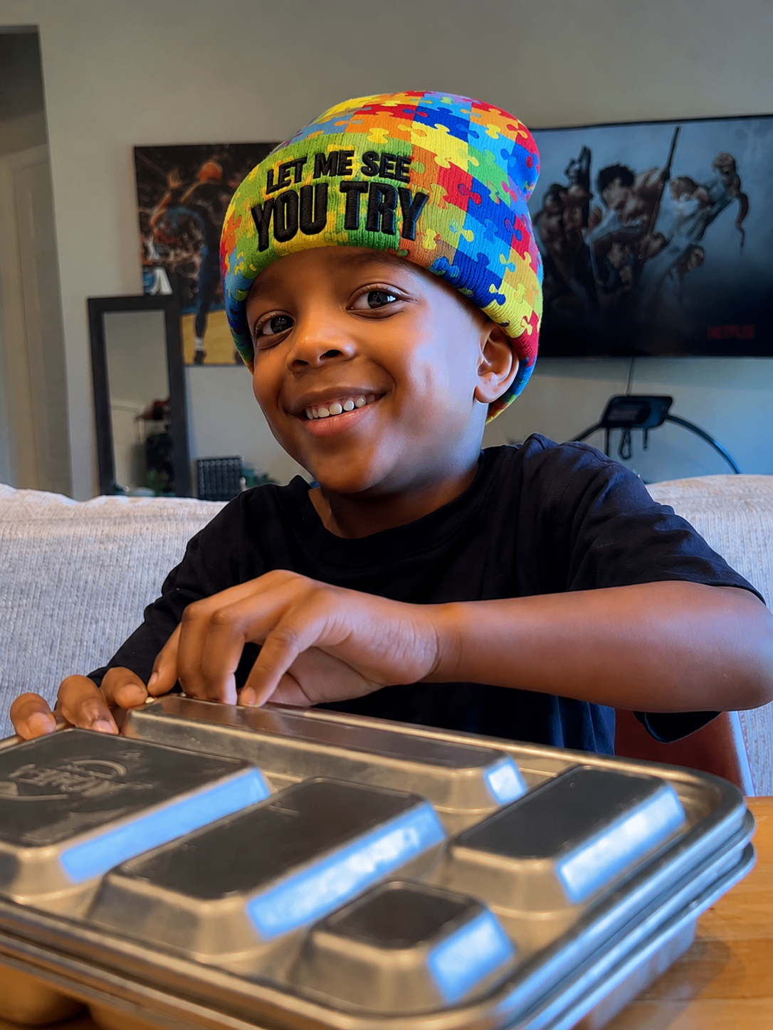 Maverick wearing the autism awareness puzzle colorway beanie